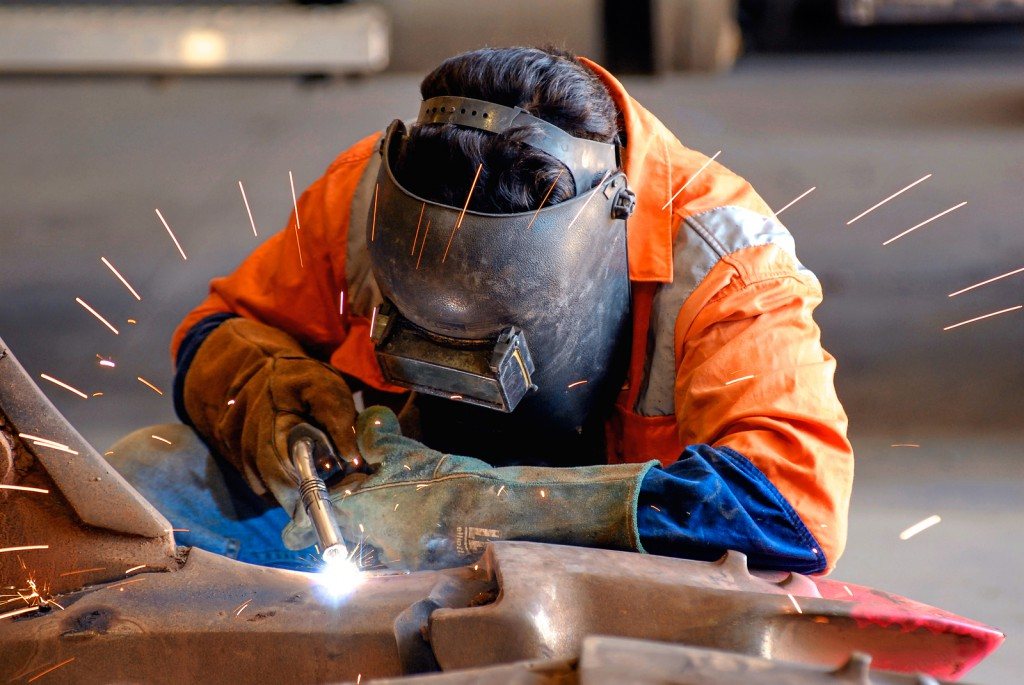 A welder joining steel in the CAE ASIA workshop