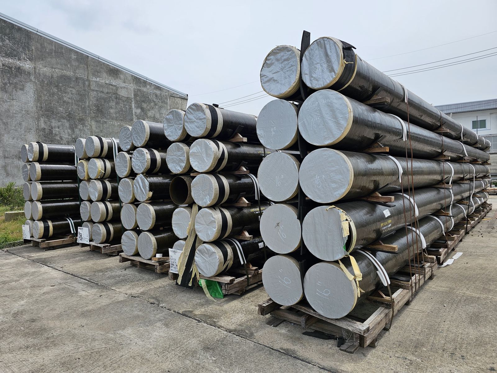 NOV FGS Bondstrand GRE pipes stacked in the yard