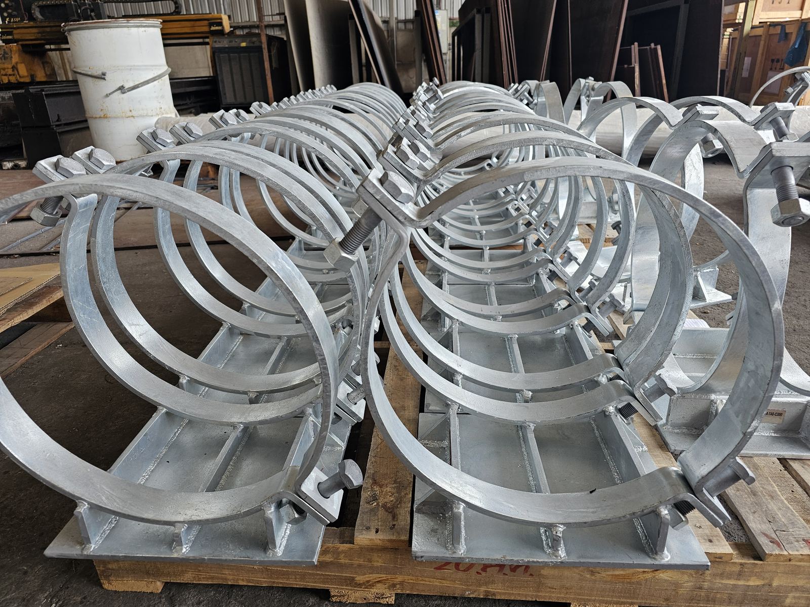 A batch of finished pipe clamps on a pallet
