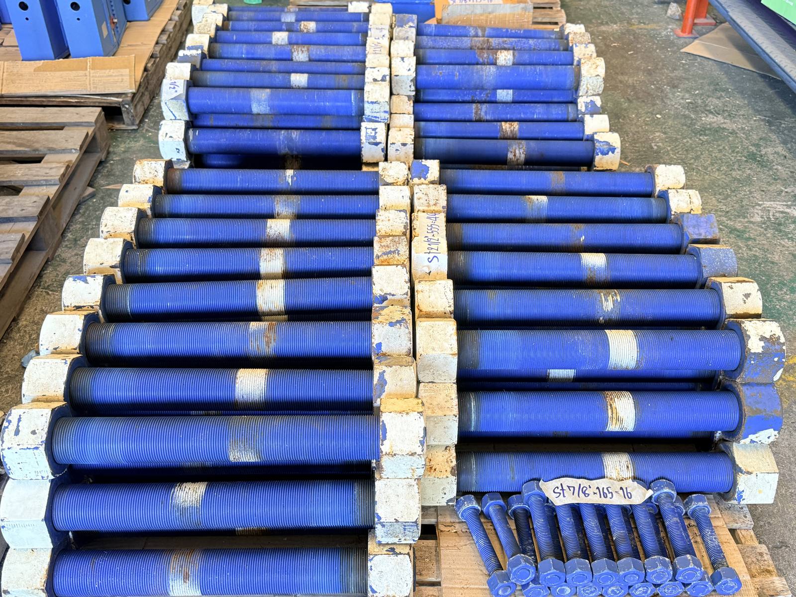 Reconditioned stud bolts with a blue protective coating